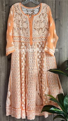 Gorgeously hand embroidered georgette Anarkali in a peachy orange color. Beautiful craftsmanship, neatly embroidered. Anarkali Length : 48 inches Orange Straight Kurta With Chikankari Embroidery, Orange Anarkali Set With Chikankari Embroidery, Bollywood Orange Anarkali Set With Intricate Embroidery, Orange Georgette Kurta With Zari Work, Unstitched Orange Chikankari Kurta, Festive Orange Anarkali Set With Intricate Embroidery, Bollywood Style Orange Traditional Wear With Intricate Embroidery, Orange Bollywood Traditional Wear With Intricate Embroidery, Orange Georgette Salwar Kameez With Zari Work