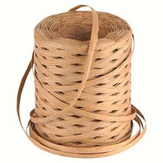 a spool of brown leather cord on a white background