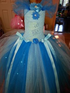 Beautiful and vibrant Ciderella inspired Tutu Dress Costume.  Made with over 900 feet of tulle this one will fit size 4 - 7.  With 3 full layers of Tulle and Glitter and Glimmer Tulle this will make every little girl feel like a Princess.  $48.00  Smaller and Larger Sizes available priced accordingly.    email me:  sugar.babies.ca@gmail.com  I will ship to most places price does not include shipping.  :) Tutu Dress Costumes, Dress Costume, A Princess, Tutu Dress