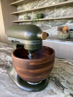 a kitchen mixer sitting on top of a counter