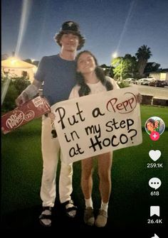 a man and woman standing in the grass holding a sign that says put a pep in my step at hoco?