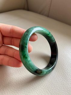 "🌈 Jade Bangle 59.7mm (2.35\"), Round Shape, Green & Light Green 🌷 Untreated Natural Jadeite/ Grade A Jade 🌷 Certification : Yes 🌷 Jade from Myanmar/ Burma 🌷 Shape : Round 🌷 Inner diameter : 59.7mm / 2.35\" 🌷 Width & Thickness : 14.2 x 8.8mm 🌷 Color : Green & Light Green 🌷 Free standard shipping from Hong Kong with tracking included 🌷 Take approximately 7-21 days to arrive worldwide ❤️ In Chinese Culture: Young people wear jade pendant will have a prosperous life, attracts Green Carved Round Bangle, Luxury Round Emerald Bracelets, Carved Green Jade Bangle, Carved Jade Round Bracelets, Carved Jade Bracelets, Green Carved Bangle Bracelet, Green Carved Bangle Bracelets, Carved Green Round Jewelry, Green Carved Round Jewelry