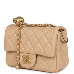 This Mini Pearl Crush square flap bag is in beige lambskin leather with aged gold tone hardware, front flap with signature CC turnlock closure, tonal stitching, rear half moon pocket, and an adjustable interwoven aged gold chainlink and beige leather strap with the "pearl" ball attachment.The interior is lined in beige leather and features a zipper pocket with Chanel pull and an open pocket below.Collection: 22C (RFID)Origin: ItalyCondition: New and never worn (plastic on hardware)Accompanied by: Chanel box, Chanel dustbag, retail UPC, RFIDMeasurements: 6.5" width x 5" height x 3" depth; 20" strap drop Chanel Box, Hermes Birkin 25, Chanel Mini, Birkin 25, Flap Bag, Lambskin Leather, Half Moon, Gold Hardware, Zipper Pocket