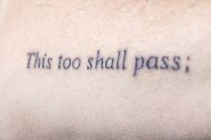 this too shall pass tattoo on the back of a man's left upper arm