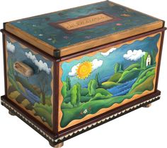 a painted wooden box sitting on top of a white floor