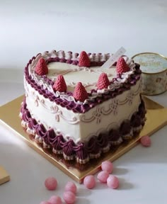 a heart shaped cake sitting on top of a table