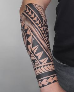 a man with a tattoo on his arm