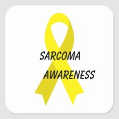 a yellow ribbon with the words sarcoma awareness