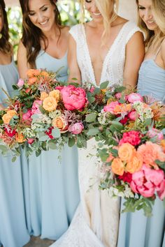 the bride and her bridesmaids are holding their bouquets