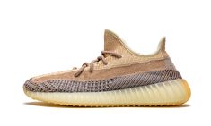 The adidas Yeezy Boost 350 V2 “Ash Pearl” is a March 2021 release of the beloved low-top shoe in yet another versatile colorway. Succeeding the “Ash Stone” and “Ash Blue” styles, the “Ash Pearl” opts for a more earth tone design that’s consistent with the general theme of many Yeezy Boost 350 V2s. The tan monofilament stripe on the lateral side of the “Ash Pearl” offers a low-contrast look against the light tan Primeknit found on the top of the shoe. A multi-directional black-and-grey pattern ap Sply 350, Pearl Shoes, Yeezy Boost 350 V2, Yeezy 350, 350 V2, Adidas Yeezy Boost 350, Cotton Bottoms, Yeezy Boost 350, Jumpsuit Shorts Rompers