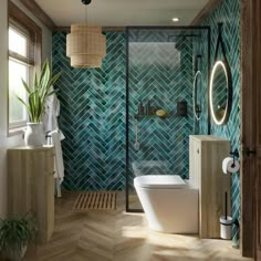 a bathroom with green tiles on the wall and wooden flooring, along with a white toilet