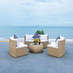 an outdoor seating area overlooking the ocean