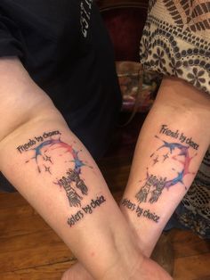 two people with matching tattoos on their arms