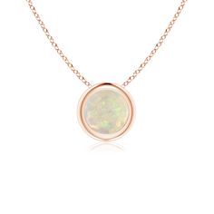 The mesmerizing round opal appears to be floating on the chain. It is secured in a 14k rose gold bezel setting. This simple yet alluring opal pendant is designed to make an elegant style statement with its stunning play of colors. Gold Opal Necklace, 14th Wedding Anniversary, Solitaire Pendant Necklace, Solid Gold Chains, Solitaire Pendant, Opal Pendants, Opal Necklace, Opal Jewelry, Accessories Necklace