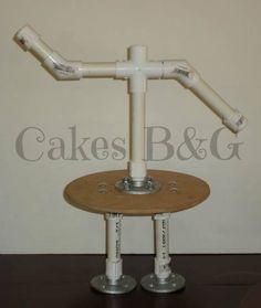 a wooden table with two white pipes on it