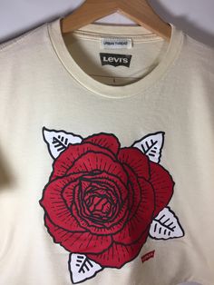 Levi's Graphic Flower Cropped Tee White Cotton T-shirt With Rose Print, Spring Cotton T-shirt With Rose Print, Rose Print Crew Neck Top For Streetwear, Spring Graphic Tee With Rose Print, Cotton Crew Neck Top With Rose Print, Spring Rose Print Graphic Tee, Cotton Graphic Tee With Rose Print, White Cotton Tops With Rose Print, White Cotton Top With Rose Print