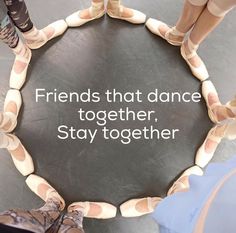 two people standing in front of a circular sign with words on it that says friends that dance together, stay together