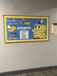 a bulletin board hanging on the wall in an office