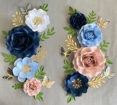 the paper flowers are arranged in different colors