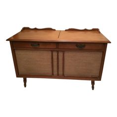 an old fashioned wooden cabinet with two drawers