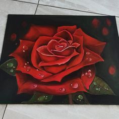 a painting of a red rose with water droplets on it