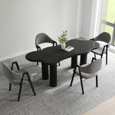 a black table with six grey chairs around it