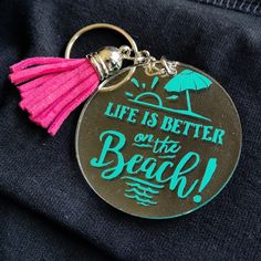 a life is better on the beach metal keychain with tassel and pink tassel