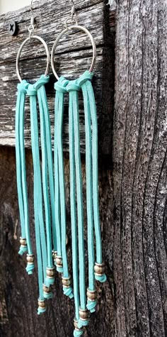 Soft, genuine suede leather fringe and silver barrel beads make these Western-inspired earrings pop. Three hand-strung tassels of supple suede cascade from 1-inch silver-tone hoops. Each end is finished with a hand-tied silver barrel bead for a total length of 6 inches (top of hoop to end of longest tassel). These earrings are surprisingly light weight given the amount of leather and metal in their design. This style is fully customizable! All metal is hypoallergenic and nickel free; however, st Western Dangle Earrings, Diy Western Accessories, Diy Leather Fringe Earrings, Western Leather Earrings, Boho Western Jewelry, Diy Western Jewelry, Leather Earrings Diy, Diy Leather Tassel, Western Diy