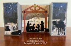 three nativity cards with the silhouettes of people and animals in front of them