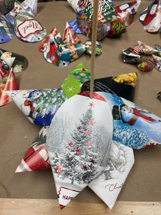 an umbrella is decorated with many different christmas designs and holiday decorations, including snowflakes