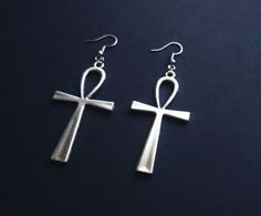 Large earrings with ankh crosses. Total drop length: 8 cm  Materials: metal alloy Colour: antique silver Sold as a pair. Earrings come with silicone backs. All items come beautifully packaged. **PLEASE NOTE** : Standard Shipping is untracked to keep the shipping costs low. If you want to TRACK YOUR ORDER please select the SHIPPING UPGRADE at checkout! I ship from Germany, you can check my shop policies for estimated shipping times to international locations. However, in some cases it can take lo Ankh-shaped Metal Earrings For Gift, Ankh Shaped Metal Earrings For Gift, Handmade Symbolic Ankh Earrings, Silver Ankh Pierced Jewelry, Silver Ankh Shaped Pierced Jewelry, Silver Ankh-shaped Pierced Jewelry, Silver Ankh Shaped Pierced Earrings, Pierced Silver Ankh Jewelry, Silver Ankh Earrings