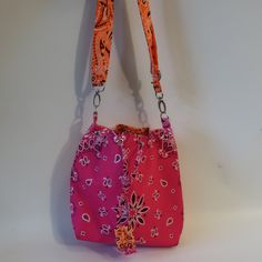 Nwt Womens Bits And Pieces To Go Pink Orange Bandana Crossbody Handbag * Retail: $140- Color: Pink, Orange/Neon Bandana Print Drawstring Closure Crossbody Strap Material: Textile Measurements: Depth: 3.6" Height: 10.2" Width: 11.5" Strap Drop: 24" New With Tags. (Bag- 777) ...Tna_rslyn_dad622- 4** Trendy Rectangular Pink Bucket Bag, Trendy Pink Tote-shaped Bucket Bag, Trendy Pink Tote Bucket Bag, Trendy Pink Shoulder Bucket Bag, Trendy Pink Rectangular Hobo Bag, Trendy Pink Crossbody Bucket Bag, Summer Shoulder Bag With Snap Closure, Pink Bucket Bag With Removable Pouch For Daily Use, Pink Rectangular Bucket Bag For Daily Use