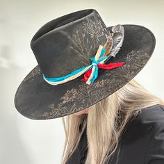 Rancher style cowboy hat for cowgirls custom burned by hand exclusively for Bourbon Cowgirl! We worked with this popular designer to create our very own look. 100% wool rancher hat in black which looks great with every outfit. One size fits all, as the interior band is adjustable to fit most. A beautiful rancher style with a pinch crease, this gorgeous black cowgirl hat is sanded and torched to a beautifully burnished and distressed finish. Firm shape (do not crush). Our artisan has hand burned Rancher Hats, Horse Flowers, Country Music Concerts, Black Cowgirl, Bullet Shell, Rancher Hat, Hat Custom, Cowgirl Hat, Band Design