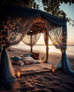 a canopy bed with lights on the beach