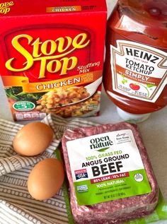 ingredients to make an entree laid out on a wooden counter top, including eggs, mayonnaise and ketchup