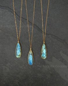 Labradorite gemstone with lots of shimmering color. These beautiful gems are made with a Gold Filled chain in your preferred chain length. Customize your necklace in your choice of cable, link or satellite chain.  These Labradorite pendants are have a multifaceted finish so they beautifully shimmer and catch light. The back and the front of the pendant  is the same. These pendants are approx. 2" inches in length, take this into consideration when selecting your chain length.Labradorite is known Labradorite Necklace With Gemstone Accents For Gift, Labradorite Jewelry With Gemstone Accents For Gift, Gift Jewelry With Gemstone Accents In Labradorite, Spiritual Labradorite Gemstone Necklace, Gold Labradorite Crystal Necklace With Gemstone Beads, Gold Crystal Necklaces With Gemstone Beads, Laboradite Jewelry, Labradorite Jewelry Necklace, Floating Diamond Necklace