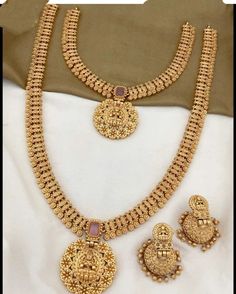 Traditional handcrafted gold plated Goddess temple necklace set from the house of the Lucentartsjewellery Shop. Its intricate  detailing with peacock motifs and studded ruby stones makes it look more royal and elegant. Adorned with matching attire, it will add brilliance and spark to the entire look. Perfect choice for weddings, parties, gifting, and other Indian festivals. Keep it in Zip Locks or Plastic Boxes. Dispatched within 7 working days. Keep the jewelry away from heat, water, sprays, an Gold Bridal Necklace With Intricate Design As Gift, Traditional Gold Necklace For Marriage, Gold Jewelry Sets As Gift With Intricate Design, Gold Temple Jewelry Bridal Necklace For Anniversary, Gold Plated Necklaces For Marriage, Handmade Gold Jewelry Sets For Celebration, Handmade Gold Plated Jewelry Sets For Wedding, Elegant Gold-colored Copper Necklaces, Gold Plated Jewelry Sets For Marriage