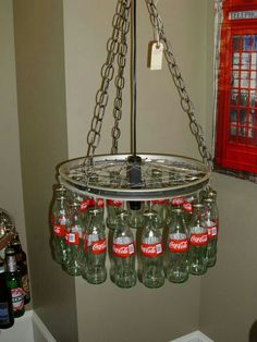 a chandelier made out of empty coke bottles