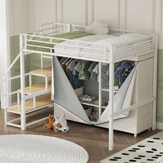 a white bunk bed with an open closet underneath it