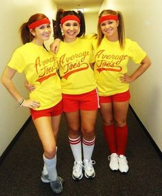 three girls in yellow shirts and red shorts are posing for the camera with their arms around each other