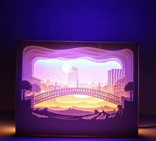 a lit up box with an image of a bridge