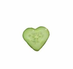 a green heart shaped candy on a white background