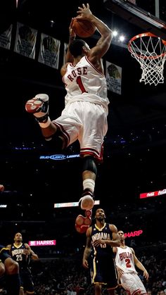 a basketball player dunking the ball into the air