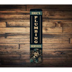 a sign that says eric's plumbing service hanging on a wooden paneled wall