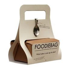 a foodie bag with a spoon in it sitting on top of a cardboard box