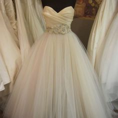 a wedding dress on display in a store