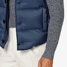 A lightweight layer that adds warmth and
  depth, this puffy mid-blue down vest is a versatile
  transitional piece that lends any look some
  dynamic volume. Blue Duck Down Puffer Jacket For Fall, Casual Spring Duck Down Outerwear, Casual Duck Down Outerwear For Spring, Blue Duck Down Puffer Outerwear, Functional Blue Nylon Puffer Jacket, Blue Duck Down Outerwear For Fall, Casual Spring Duck Down Puffer Jacket, Casual Duck Down Puffer Jacket For Spring, Casual Blue Vest For Winter