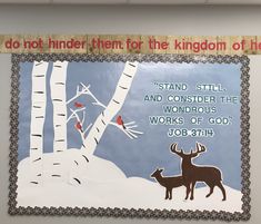 a bulletin board with an image of two deer in the snow and a quote about god