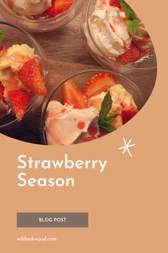 four small bowls filled with strawberries and ice cream on top of a wooden table