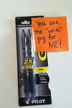 two pens are in the package with an orange sticky note attached to it that says, you are the write's guy for me